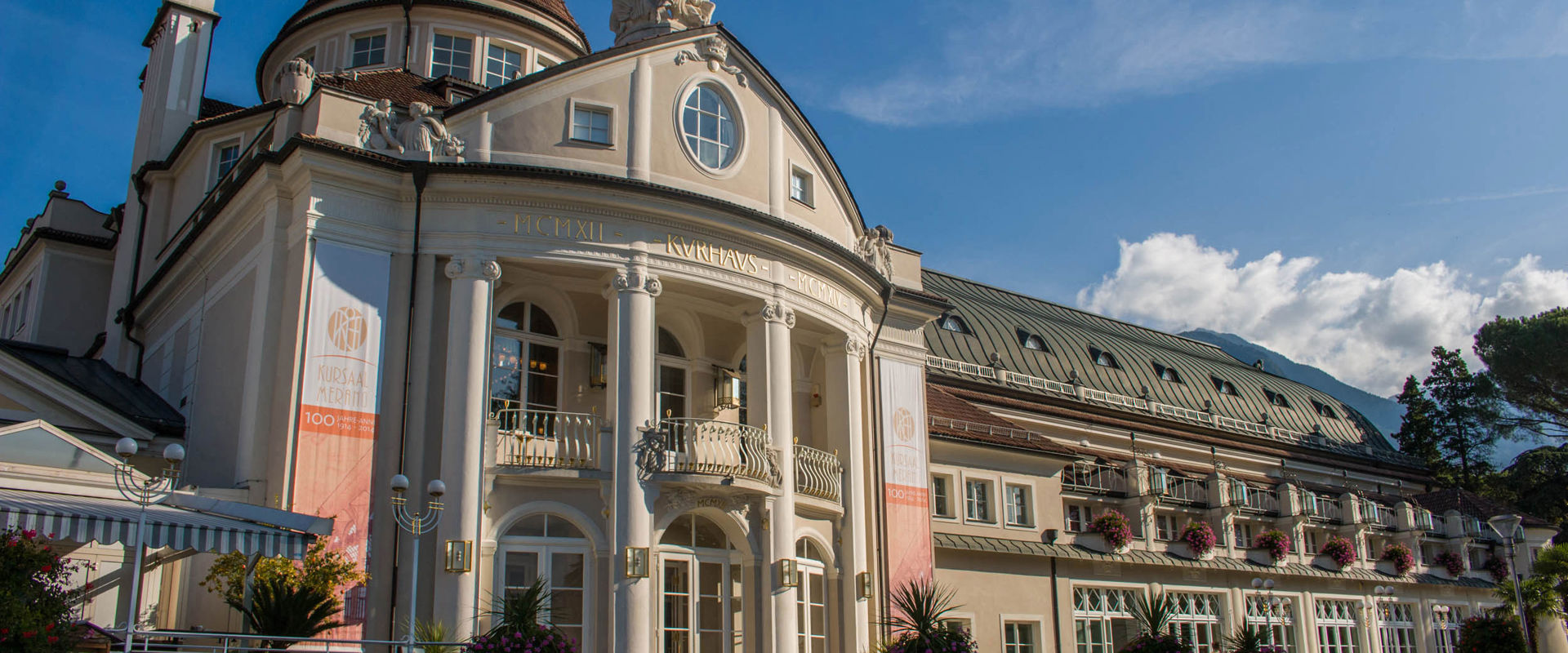 Elegant architecture of the Meran Kurhaus and Municipal Theatre.
