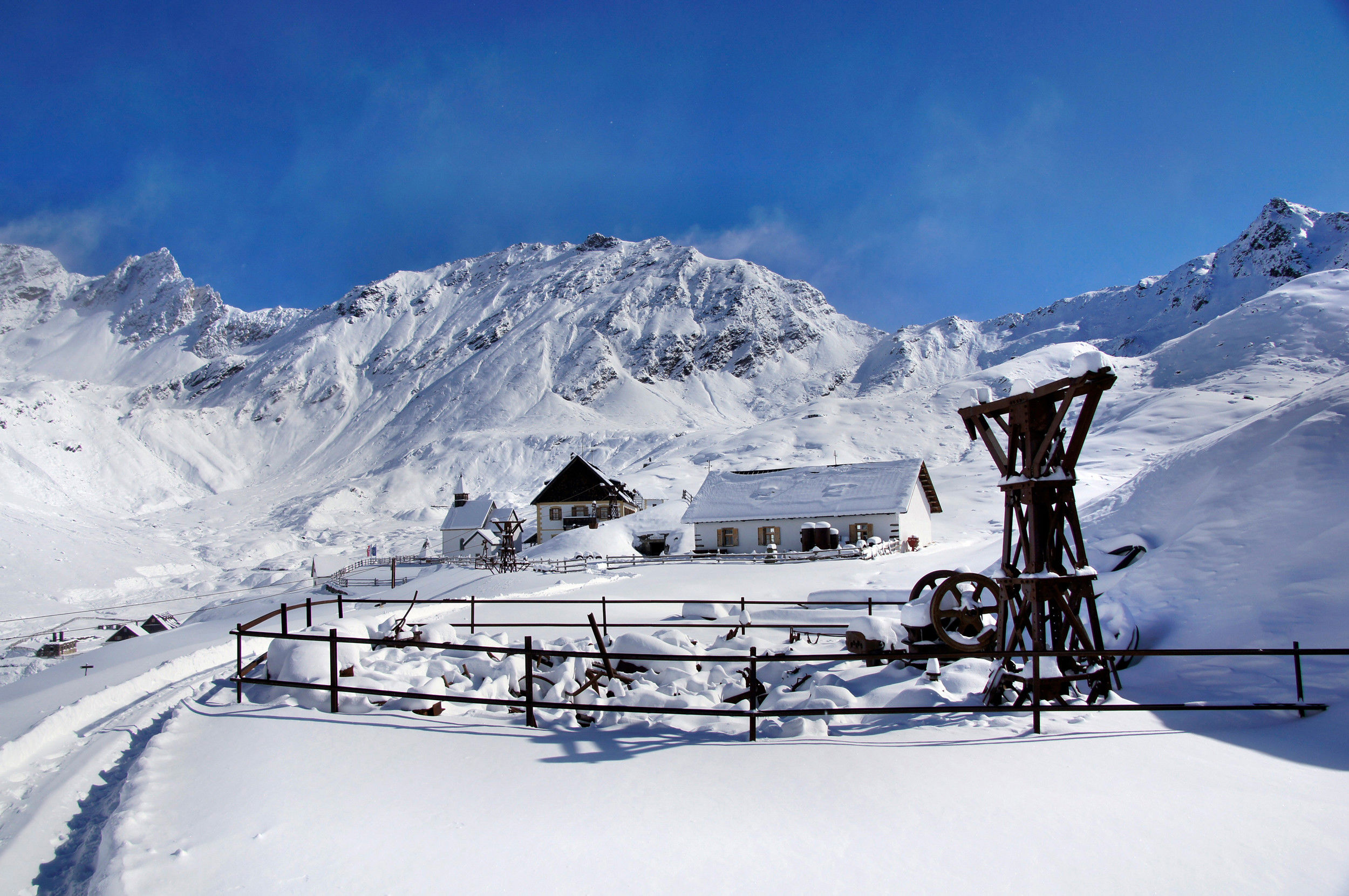 Snow-covered refuge Schneeberg and church Maria Schnee.