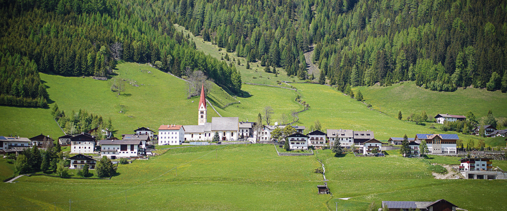 Pfitsch Kematen in Pfitsch Valley with lush green meadows