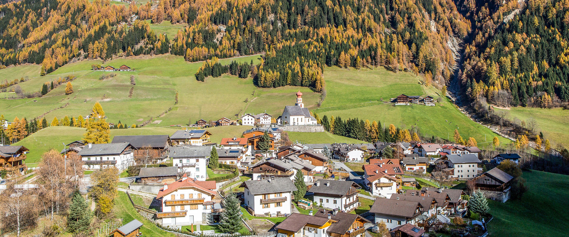Pfunders Pfunders with parish church & forest in autumn colours