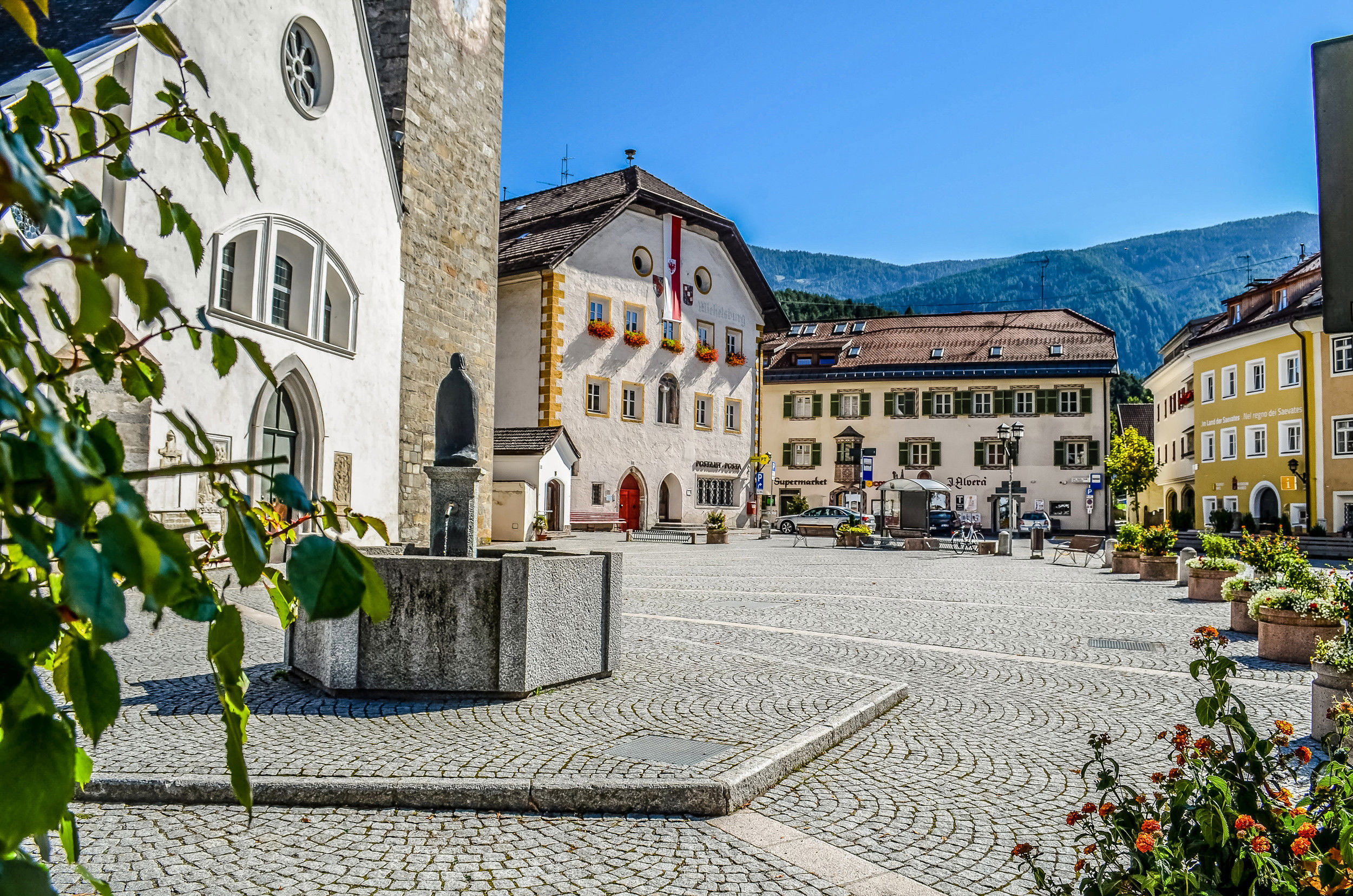 Village square with water fountain in St. Lorenzen