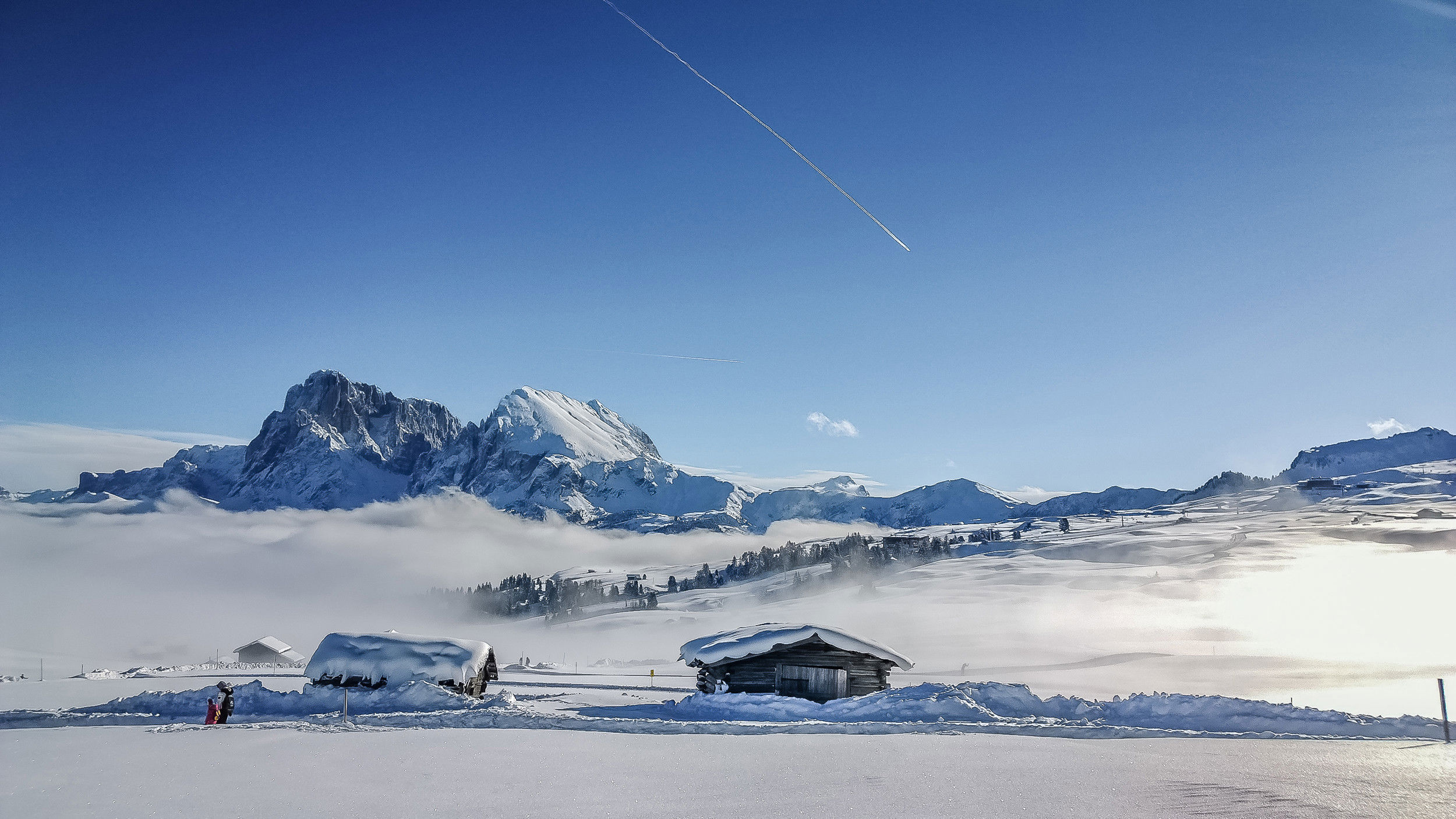 Snow-covered huts in the mountains.