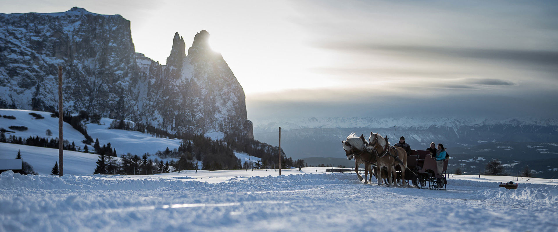 Couple enjoying the winter toboggan ride.