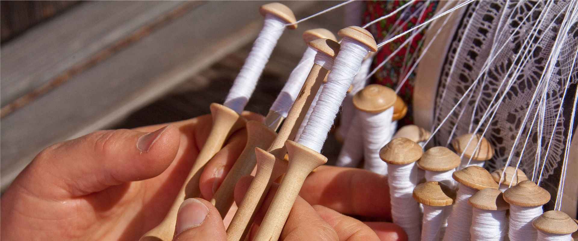 Lace A woman is making a lace.