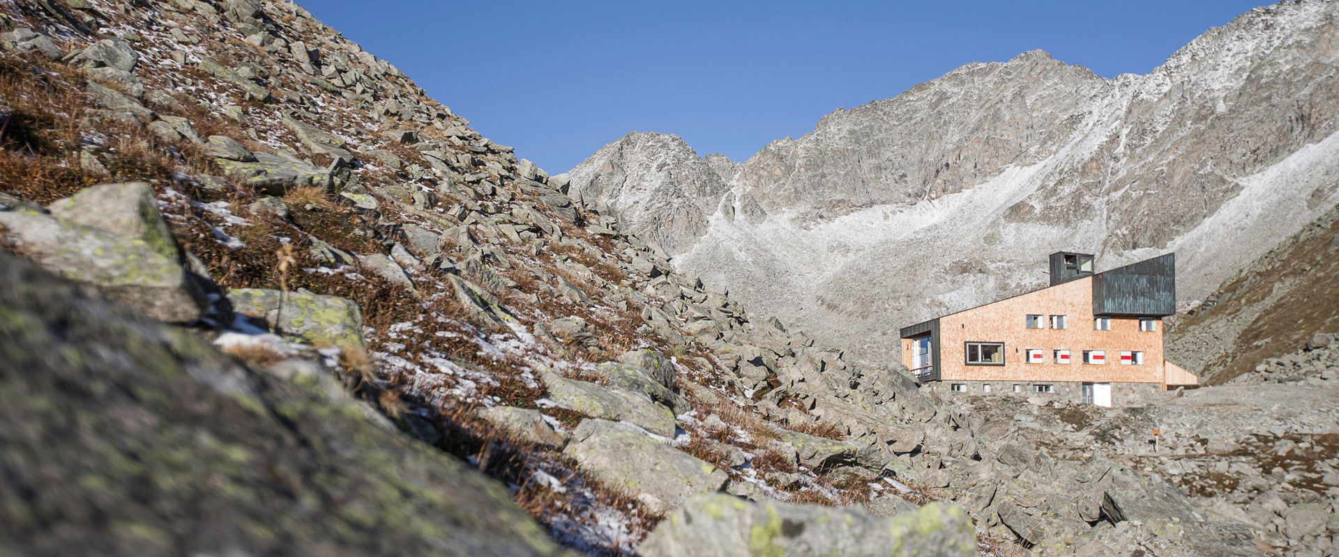 High-altitude trails in South Tyrol View of the Edelraut hut along the Neveser high trail.