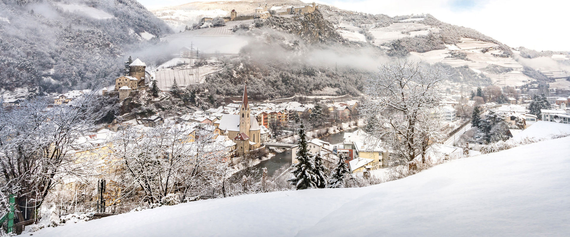 Klausen View of Klausen with Branzoll Castle & Säben Monastery in winter