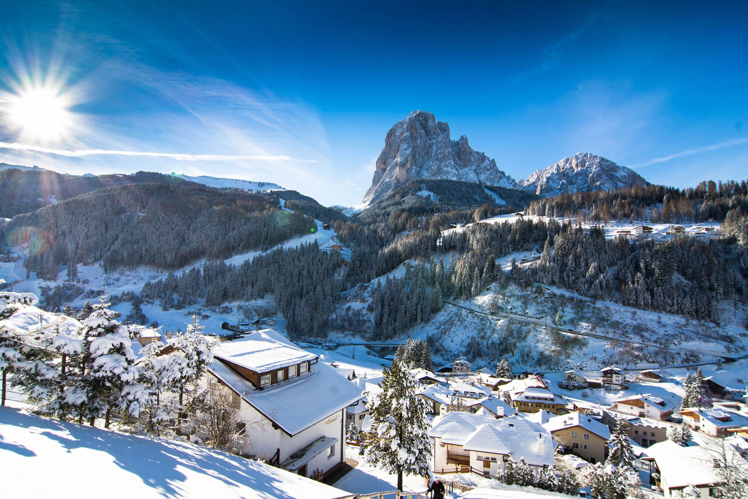View of St. Christina in Gröden with snow landscape & Langkofel massif