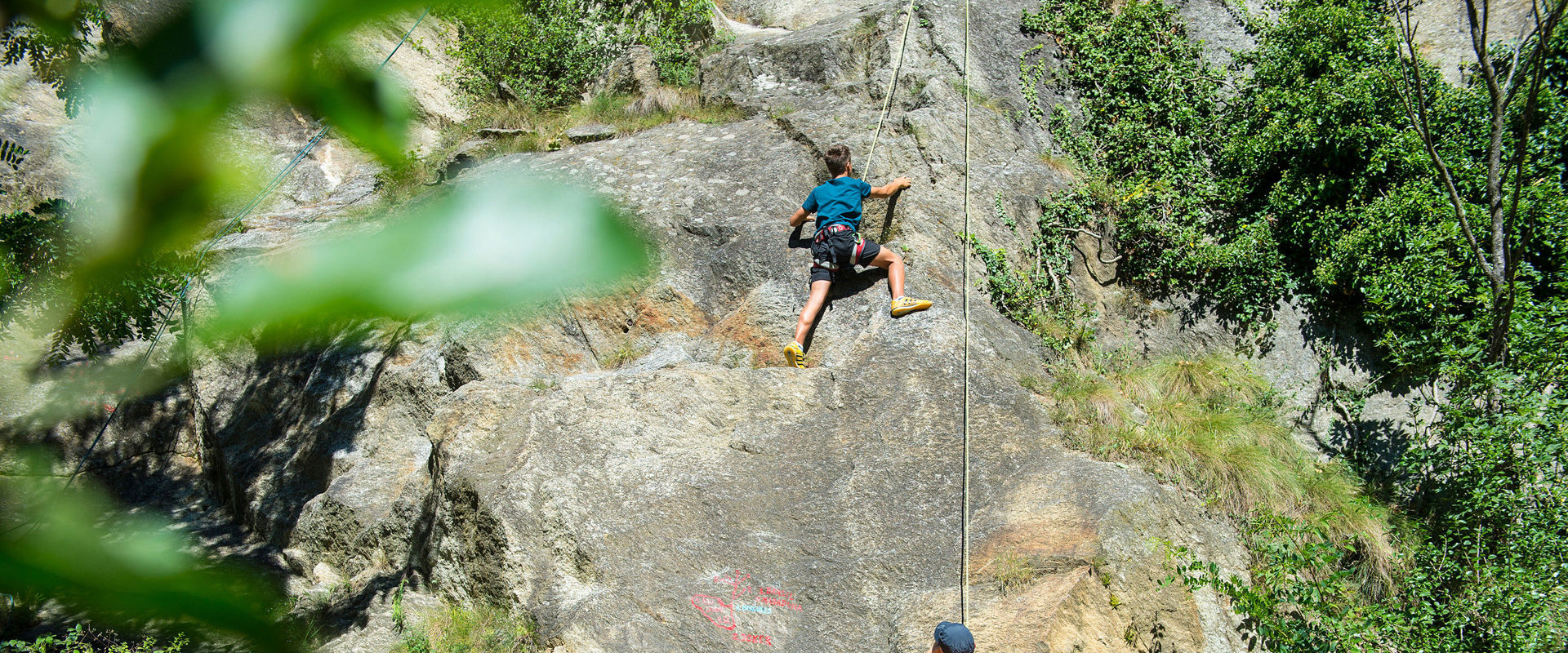 Outdoor Climbing in South Tyrol - Climbing area Father and children climbing together in the Juval climbing area near Naturns.