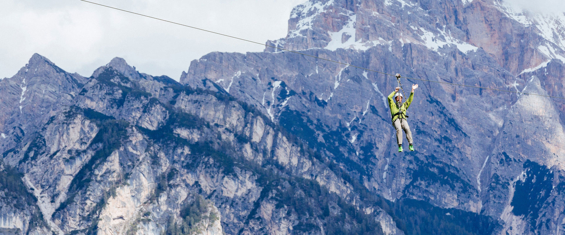 Zipline Adrenaline Xtream Adventures Park Man suspended at the zipline of Adrenaline Xtream Adventures Park.