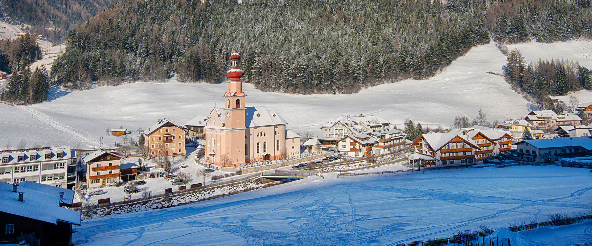 St. Johann in the Ahrntal Valley View of St. Johann in the Ahrntal Valley with surrounding snowy landscape