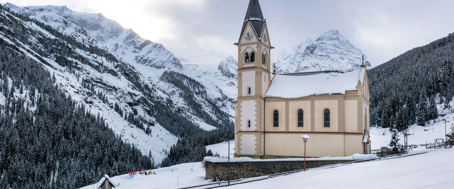 The parish church of Trafoi in winter with snow.