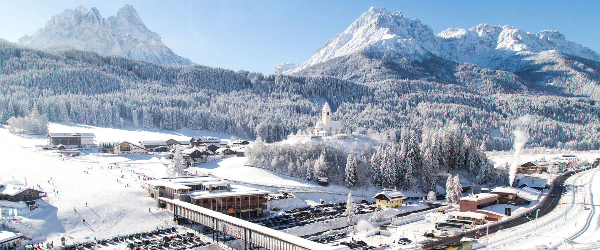 Vierschach Helm car parking with ski train Pustertal & snowcovered mountain landscape