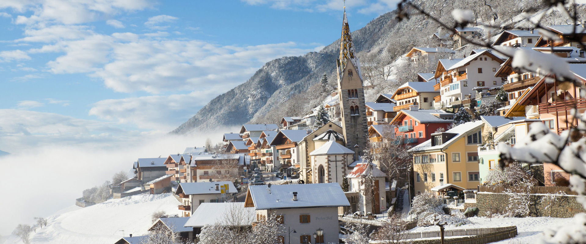 Barbian Snow-covered houses, church and hosues in Barbian