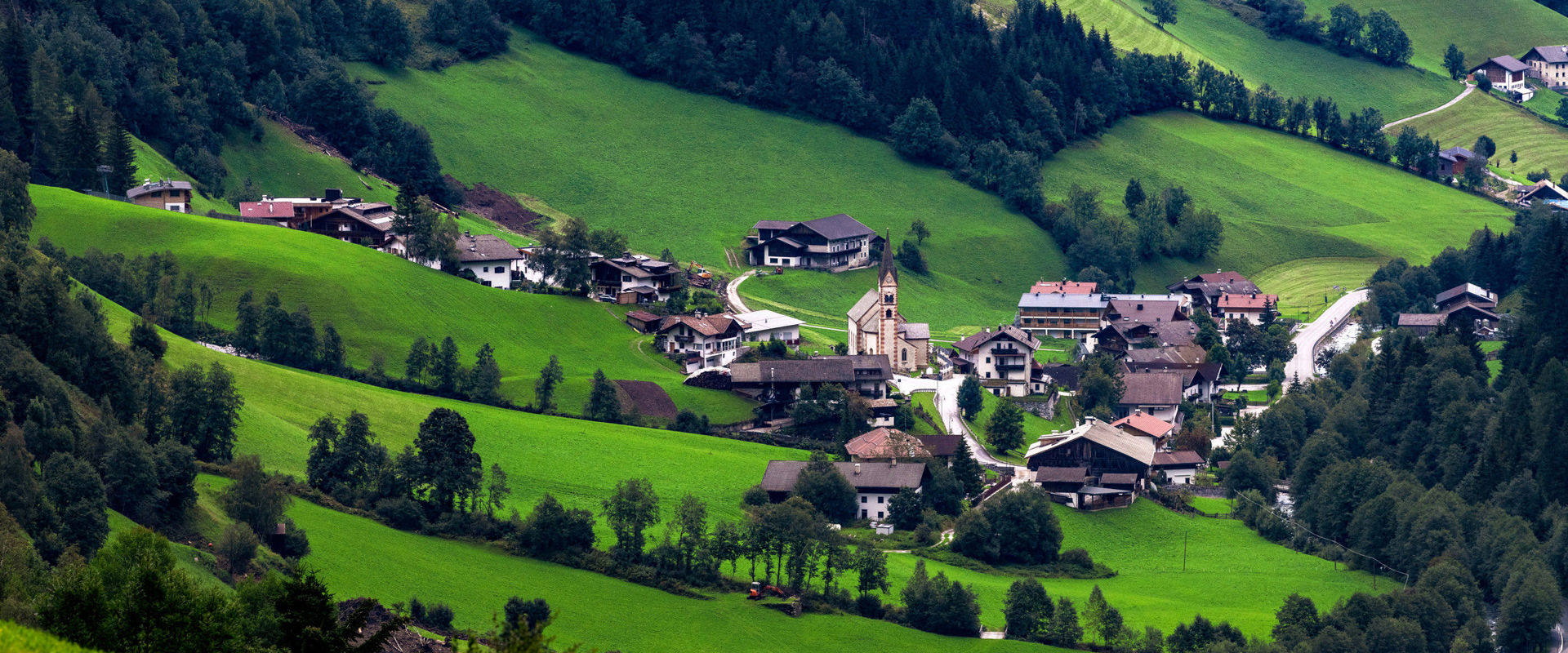 Pflersch View of St. Anton in Pflersch Valley with lush green meadows