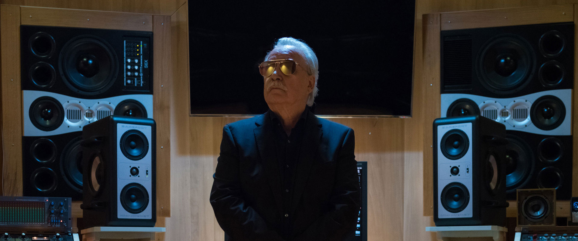 Giorgio Moroder The elderly music producer sits at the mixing desk in a recording studio.