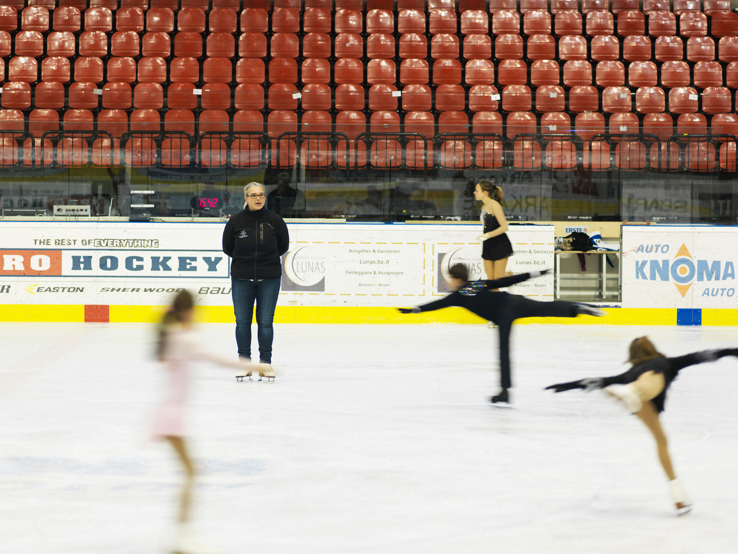 Figure skaters training in the ice rink.