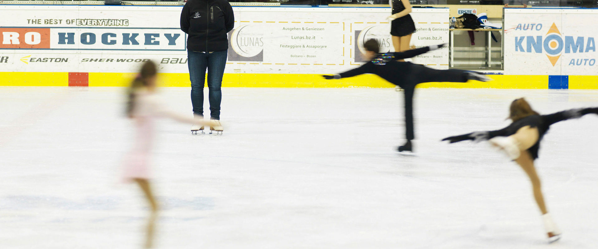Figure skaters on ice Figure skaters training in the ice rink.