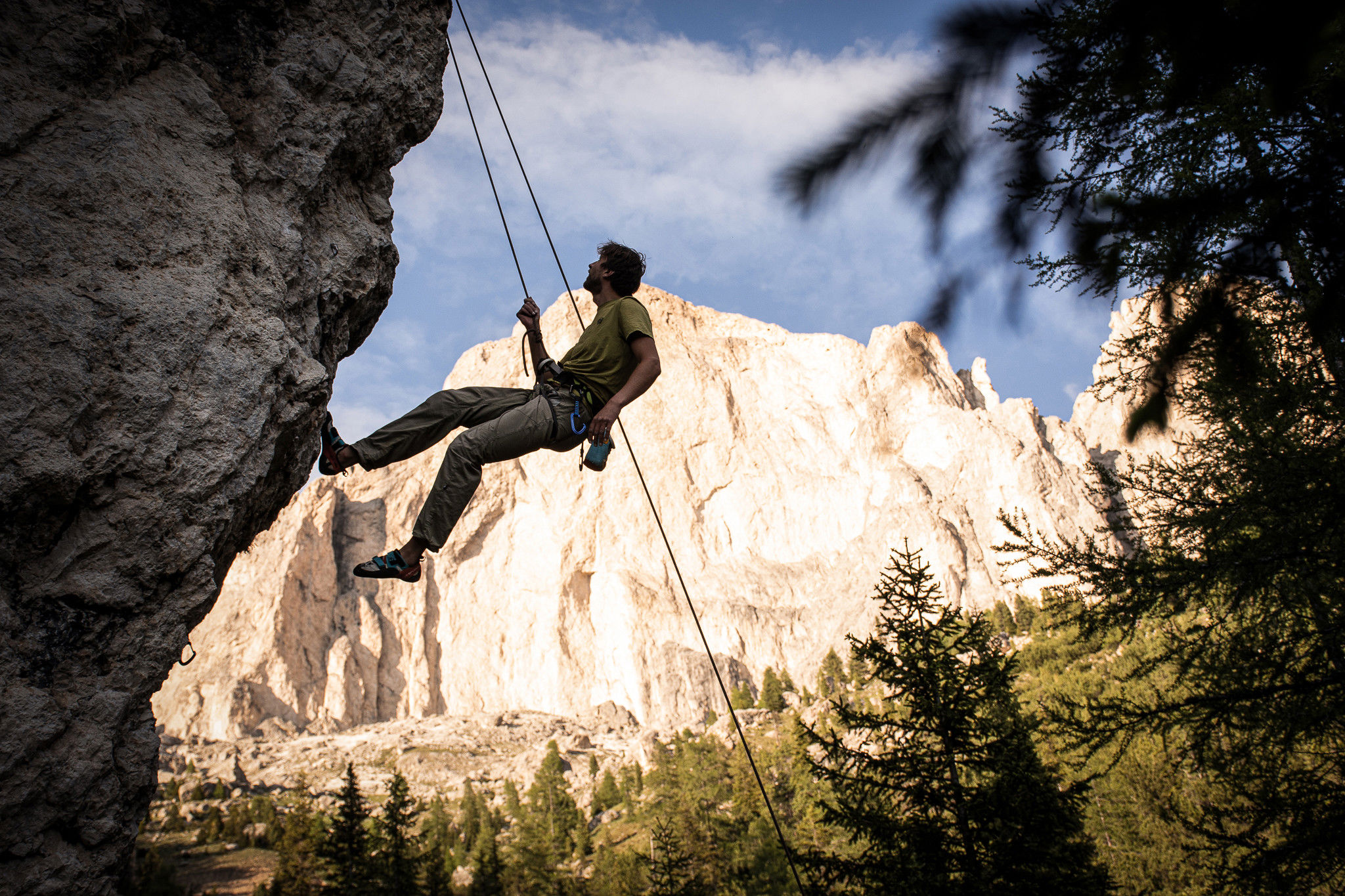 A man climbs on the Kleine Rotwand in the climbing area at the Karerpass.