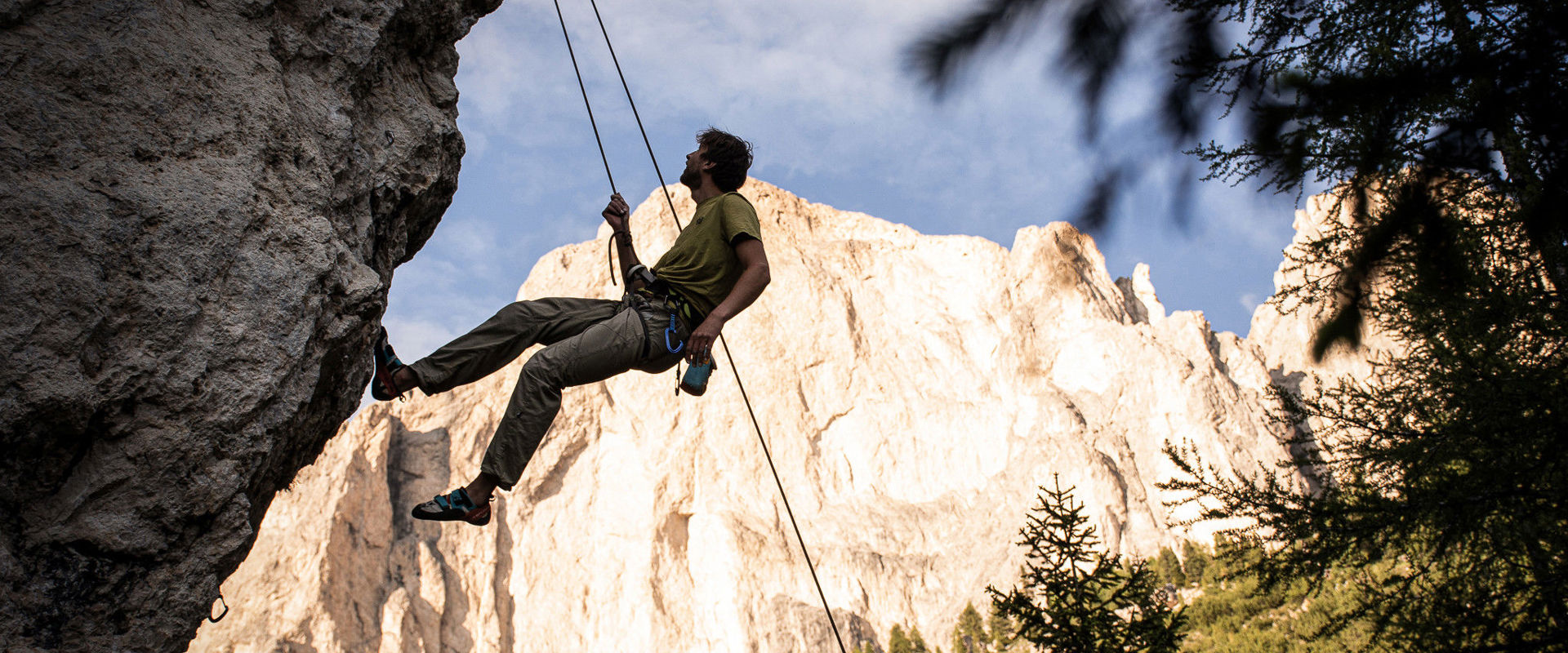Outdoor climbing in South Tyrol - Climbing areas A man climbs on the Kleine Rotwand in the climbing area at the Karerpass.