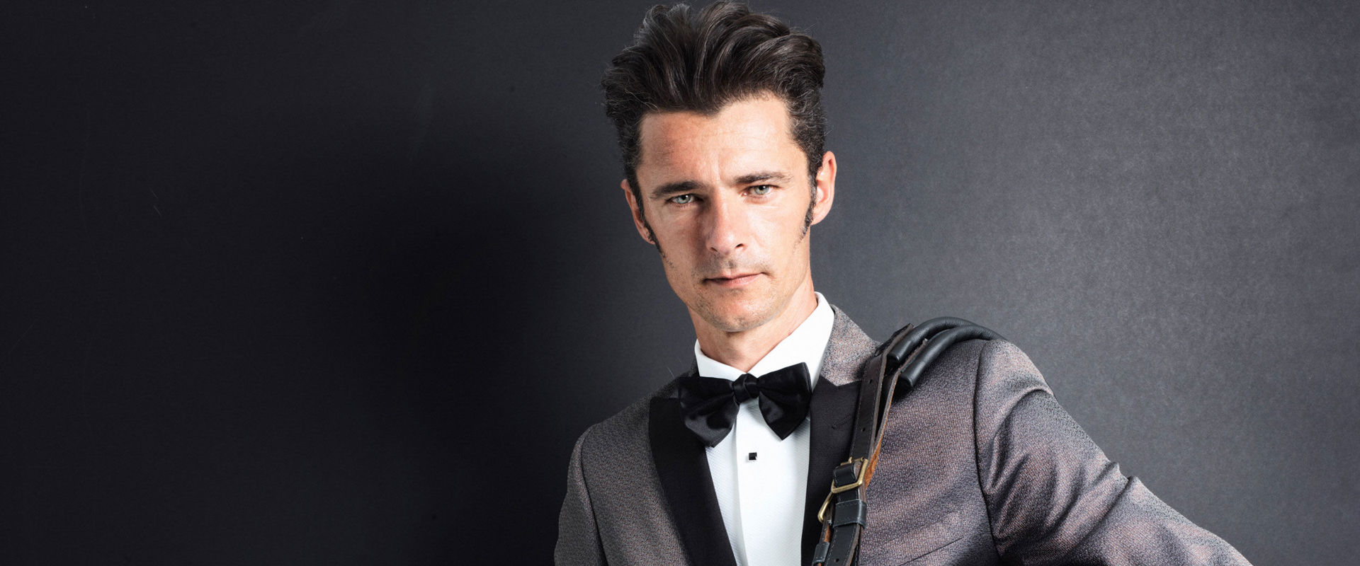 Musician Herbert Pixner Elegantly dressed musician with brick organ.