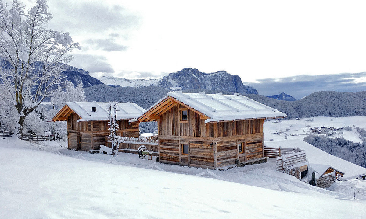 Chalets in a snow-covered winter landscape with wonderful views.