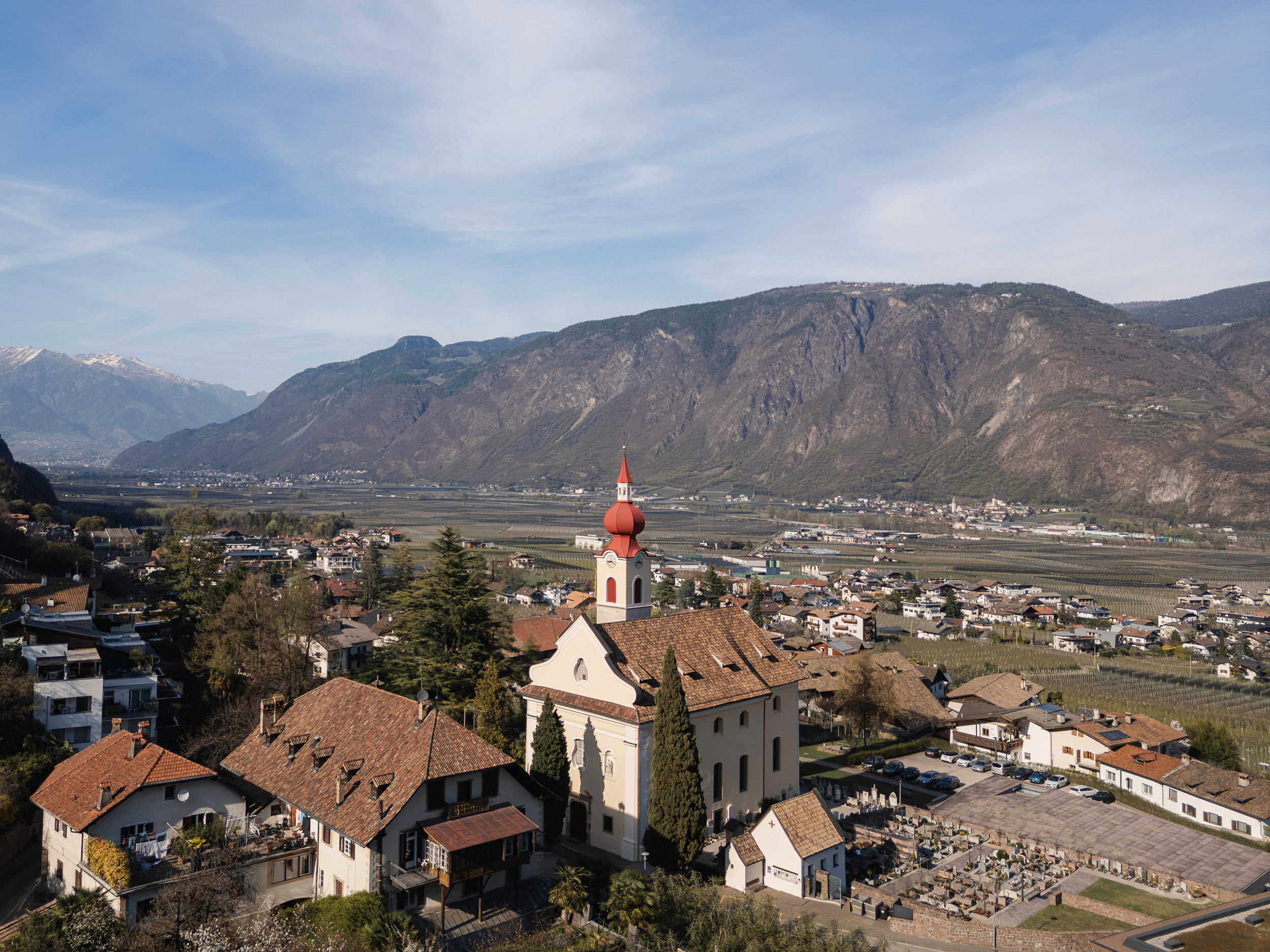 View of the Etsch valley and the rose village of Nals and its church