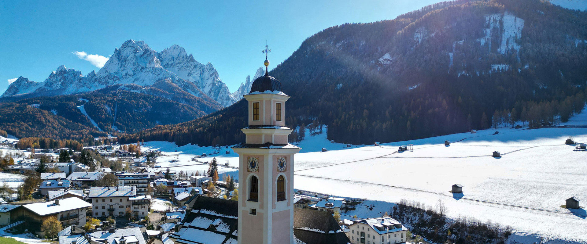 Sexten View of the parish church in Sexten and mountains in the background