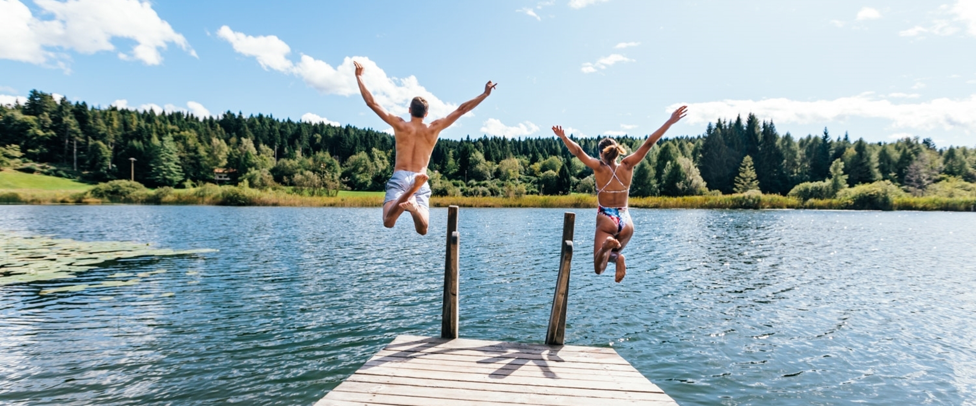 The lake near Margreid on the South Tyrolean Wine Route, is ideal for swimming and sunbathing in summer.