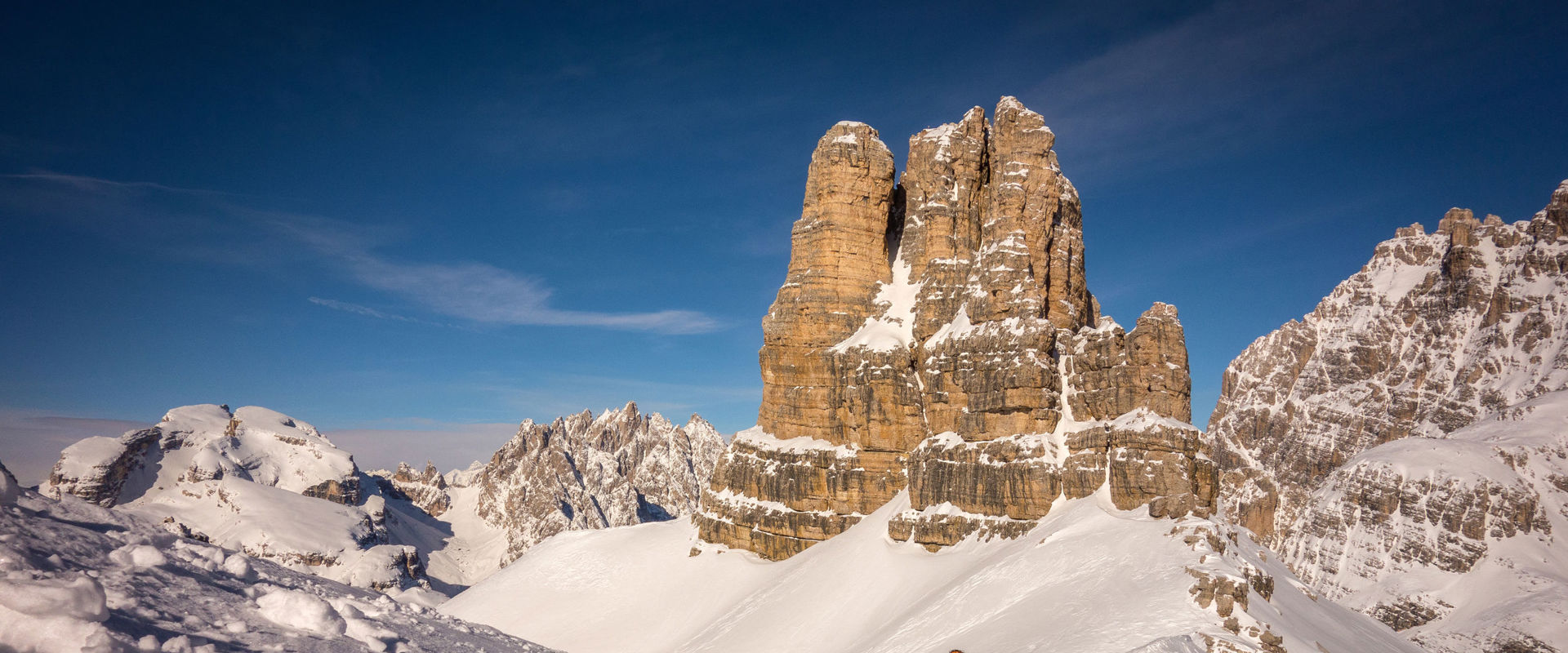 Ski tourers on the Sextnerstein. Ski tourers on the ascent of the Sextnerstein. In the background, one of the Three Peaks.