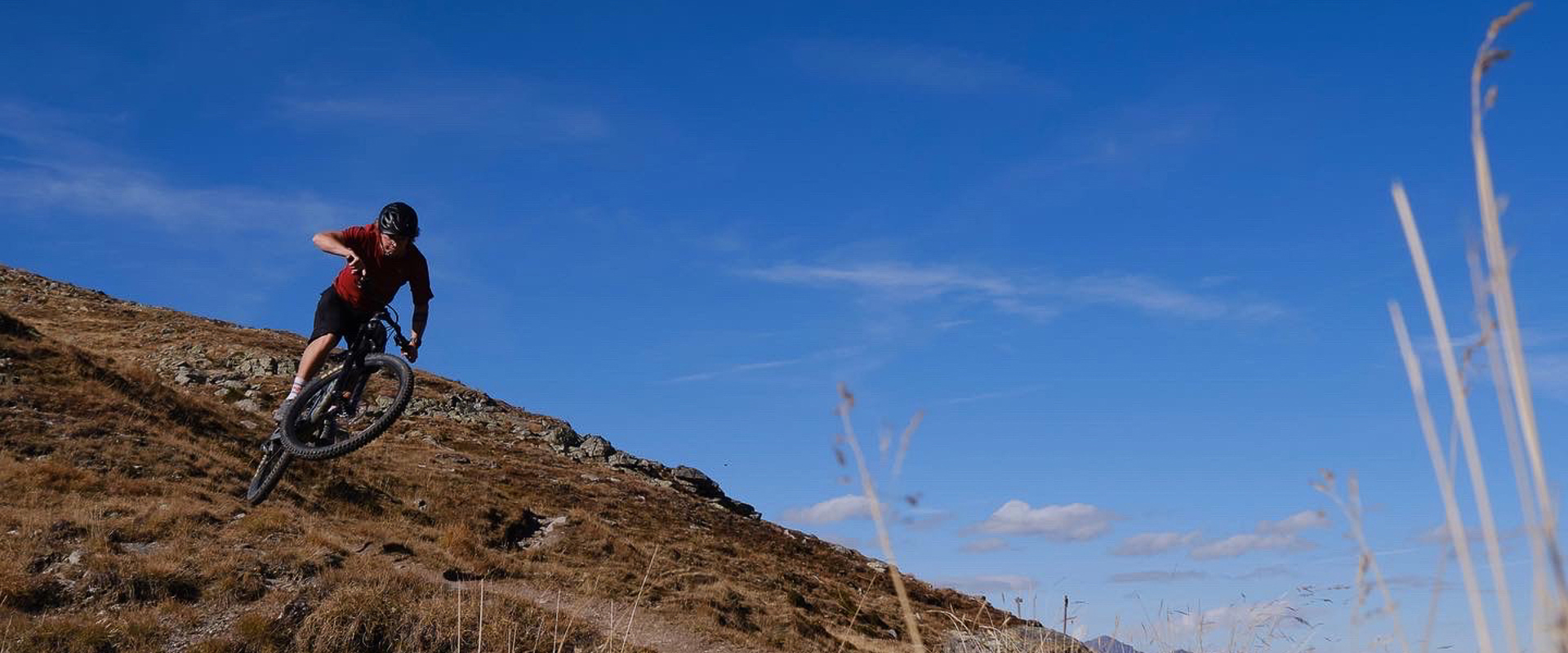 A mountain biker descending the Stoneman Trail in autumn