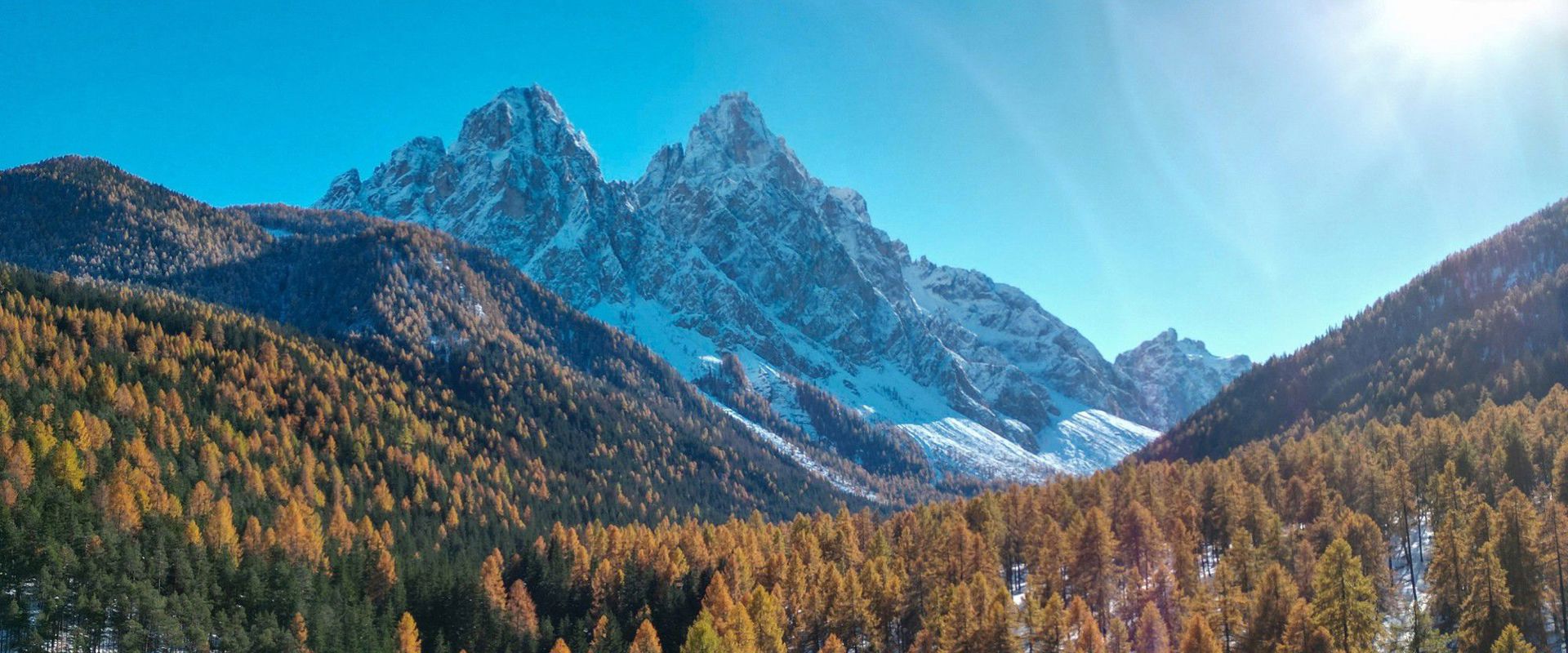Innerfeld valley Innerfeld valley with golden yellow coloured trees and snow-covered mountains