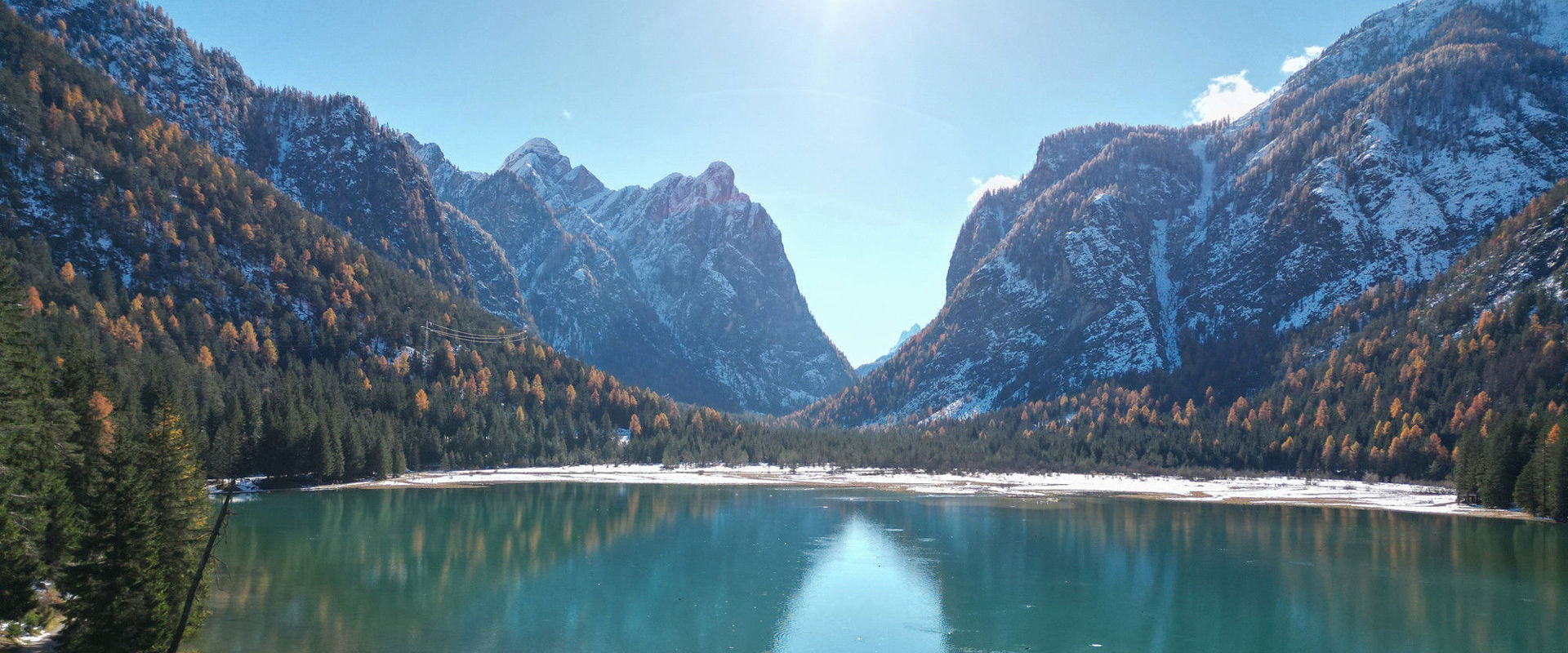 Lake Toblach in winter View of the snow-covered Lake Toblach and the surrounding mountains.