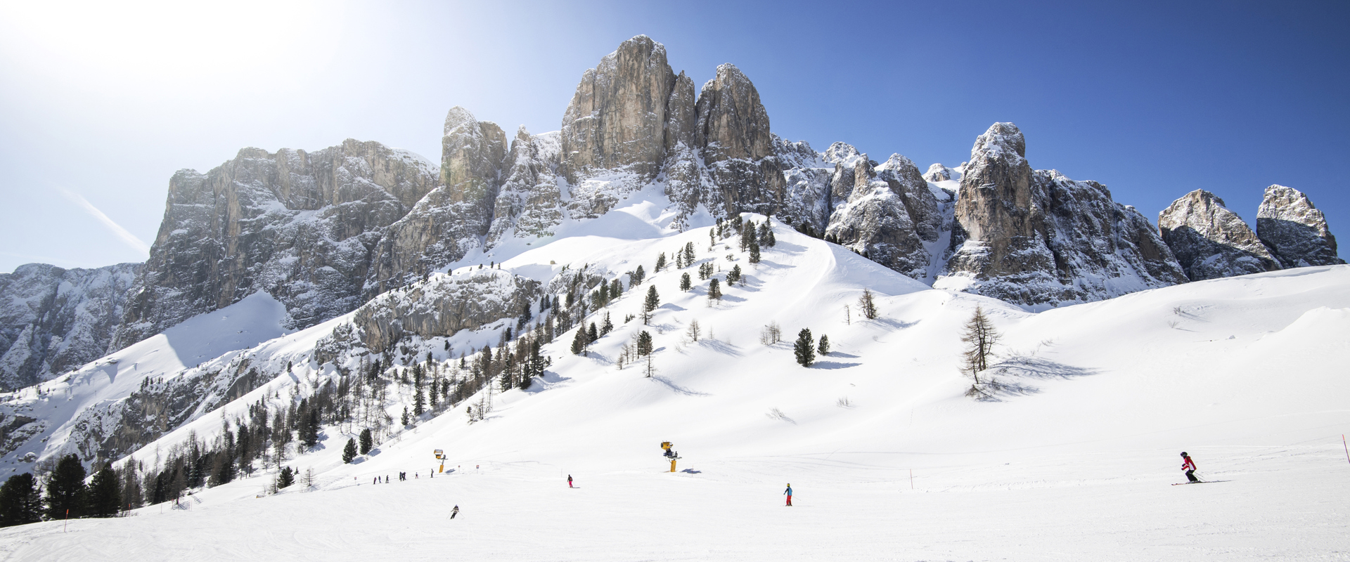 Grödner Joch/Passo Gardena Skiing in bright sunshine with Dolomite peaks